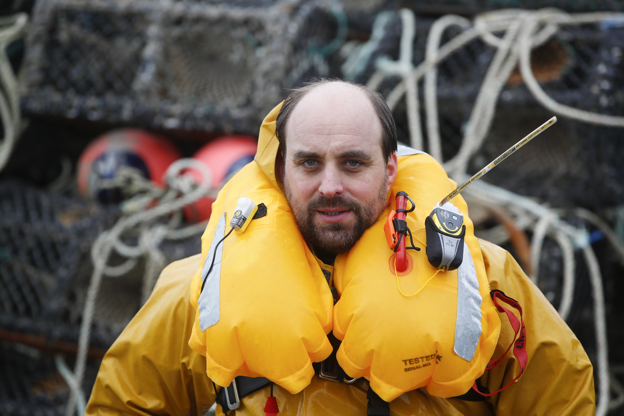 Fisherman wearing a PLB