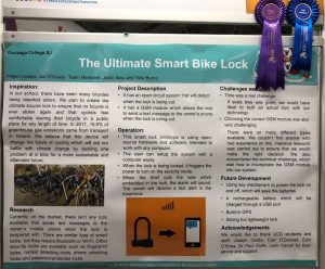 Photograph of stand - reads "The Ultimate Smart Bike Lock"